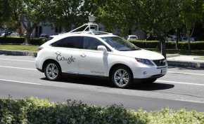 In this May 13, 2014 file photo, a Google self-driving car goes on a test drive near the Computer History Museum in Mountain View, Calif.